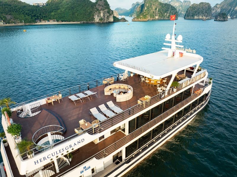 Hercules Grand Luxury Day Cruise sailing through emerald waters and limestone karsts in Ha Long Bay